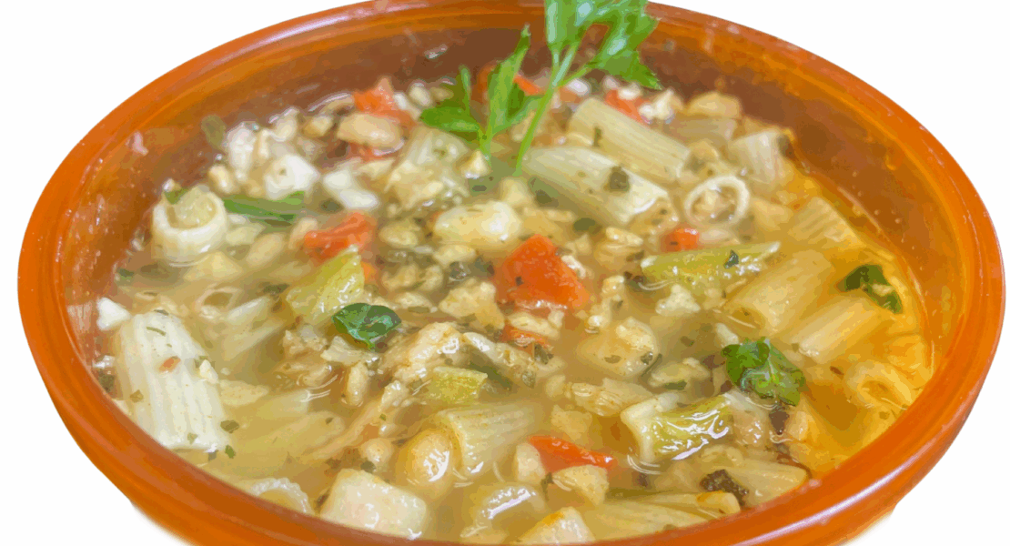 Vegan chicken noodle backpacking soup prepared in a bowl